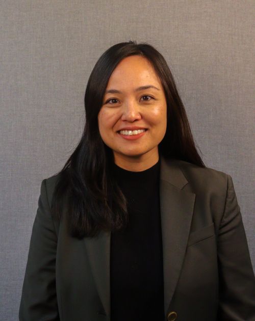 A professional headshot of Bonny Dahm, an Asian woman with long dark hair.
