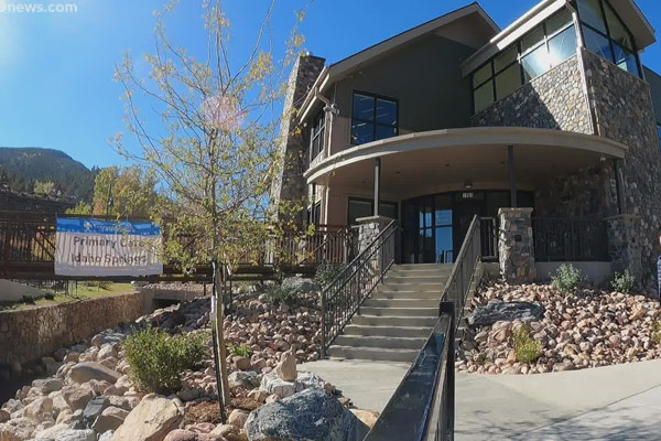 The exterior of a modern, multi-story health clinic in Idaho Springs, at the address 1969 Miner St.