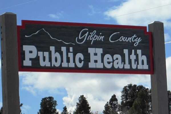 An outdoor sign that reads Gilpin County Public Health.