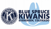 Logo for Blue Spruce Kiwanis. On the left is the circular Kiwanis International emblem. On the right, text reads "Blue Spruce Kiwanis, Evergreen, Colorado" set over a light blue graphic of a stylized cowboy hat.
